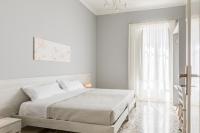 A bed or beds in a room at Stazione Notarbartolo Bright & Cozy Apartment