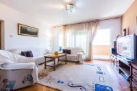Televízia a/alebo spoločenská miestnosť v ubytovaní Oleander Apartment