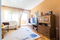 Televízia a/alebo spoločenská miestnosť v ubytovaní Oleander Apartment