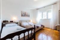 Posteľ alebo postele v izbe v ubytovaní Oleander Apartment