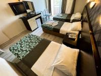 A bed or beds in a room at CASTLE PARK HOTEL