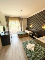 A bed or beds in a room at CASTLE PARK HOTEL