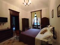 A bed or beds in a room at Villa Siciliana