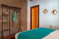 Posteľ alebo postele v izbe v ubytovaní SUITES CASA DE LAS COLUMNAS