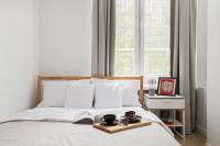 Posteľ alebo postele v izbe v ubytovaní oompH Warsaw Nowy Swiat Apartment