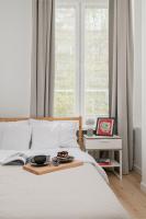 Posteľ alebo postele v izbe v ubytovaní oompH Warsaw Nowy Swiat Apartment