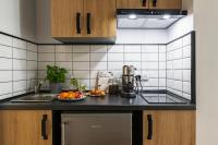 Kuchyňa alebo kuchynka v ubytovaní oompH Warsaw Nowy Swiat Apartment