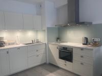 Kuchyňa alebo kuchynka v ubytovaní Apartamenty Kapitańskie Kasprowicza 20A taras