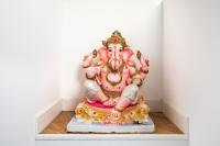 a statue of aitating deity in a room at Het Lichthuis in Zandvoort