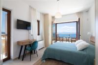 A bed or beds in a room at Villa Dafni - Infinite Sea Vistas with Private Pool