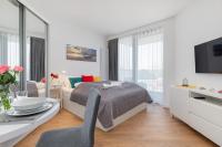 Posteľ alebo postele v izbe v ubytovaní Apartments Mazowiecka by the Sea Pobierowo by Noclegi Renters