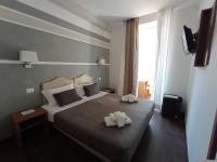 Posteľ alebo postele v izbe v ubytovaní Rome Travellers Hotel