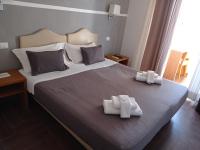 Posteľ alebo postele v izbe v ubytovaní Rome Travellers Hotel