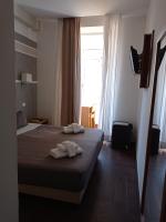 Posteľ alebo postele v izbe v ubytovaní Rome Travellers Hotel