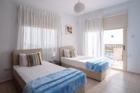 Postel nebo postele na pokoji v ubytování Eframia Dyo by Prestige Bookings