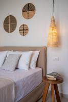 Postel nebo postele na pokoji v ubytování Thea Beachfront Suites in Lourdas beach