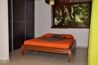 Appartement Villa Taina piscineにあるベッド