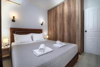 Łóżko lub łóżka w pokoju w obiekcie Anius Apartments
