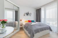 Posteľ alebo postele v izbe v ubytovaní Apartments Mazowiecka by the Sea Pobierowo by Noclegi Renters