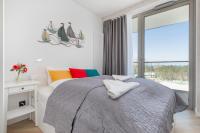 Posteľ alebo postele v izbe v ubytovaní Apartments Mazowiecka by the Sea Pobierowo by Noclegi Renters