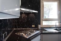 Kuchyňa alebo kuchynka v ubytovaní Villa Liam con Piscina - Goelba