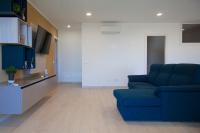 Televízia a/alebo spoločenská miestnosť v ubytovaní Villa Liam con Piscina - Goelba