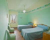 Łóżko lub łóżka w pokoju w obiekcie Villa La Fontana