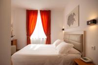 A bed or beds in a room at Hotel Villa Paradiso