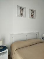 A bed or beds in a room at Appartamento U scrusciu ro mari