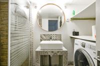 a bathroom with a sink and a mirror at Large and calm flat in the heart of Lille - Welkeys in Lille