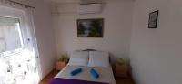 Łóżko lub łóżka w pokoju w obiekcie Major apartman