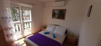 Łóżko lub łóżka w pokoju w obiekcie Major apartman