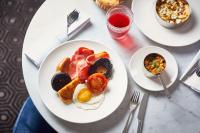 two plates of breakfast food on a table at ABode Manchester in Manchester
