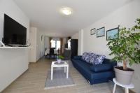 Telewizja i/lub zestaw kina domowego w obiekcie Katy Apartment