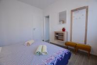 Łóżko lub łóżka w pokoju w obiekcie Katy Apartment