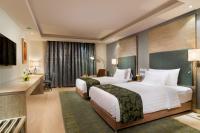 Centara Muscat Hotel Omanにあるベッド