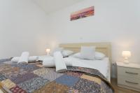 Posteľ alebo postele v izbe v ubytovaní Bloom Apartment