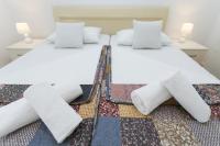 Posteľ alebo postele v izbe v ubytovaní Bloom Apartment