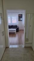 Televízia a/alebo spoločenská miestnosť v ubytovaní Apartmani Mali