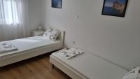 Posteľ alebo postele v izbe v ubytovaní Apartmani Mali