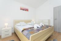 Posteľ alebo postele v izbe v ubytovaní Bloom Apartment