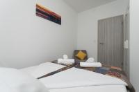 Posteľ alebo postele v izbe v ubytovaní Bloom Apartment