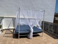 A bed or beds in a room at Alzira bonita Ático E Plaza Mayor con gran terraza