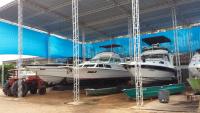 a group of boats are parked in a building at Hotel Marina Clube de Pesca in Cananéia