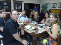 a group of people sitting around a table at Hotel Marina Clube de Pesca in Cananéia