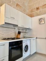 A kitchen or kitchenette at Chez Isabelle - Puglia Mia Apartments