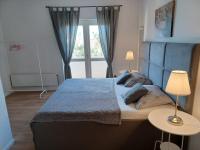 Posteľ alebo postele v izbe v ubytovaní Apartmani Sladić