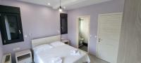 Postel nebo postele na pokoji v ubytování Sandy Cozy Apartments