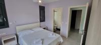 Postel nebo postele na pokoji v ubytování Sandy Cozy Apartments