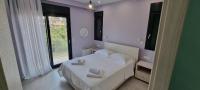 Postel nebo postele na pokoji v ubytování Sandy Cozy Apartments